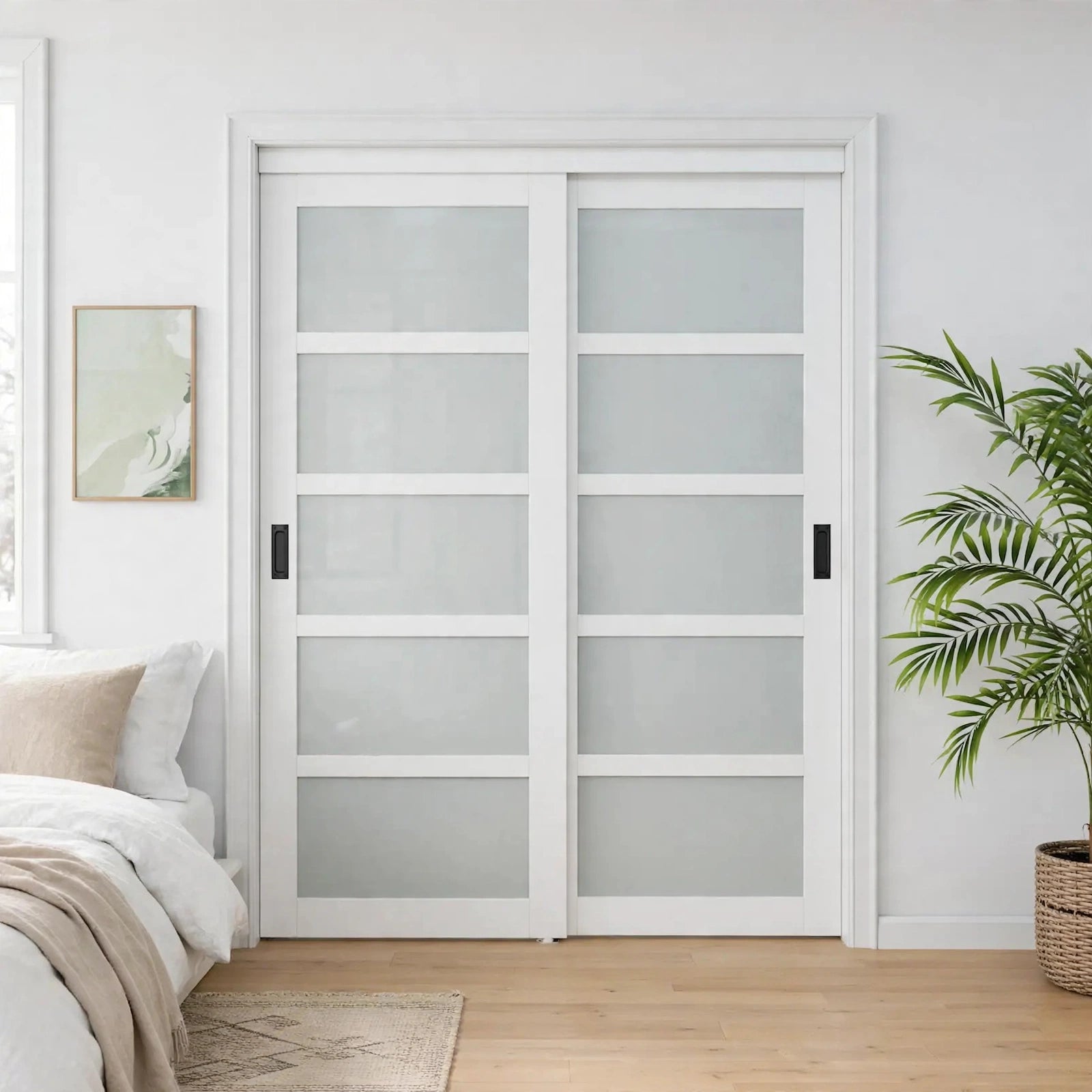 Five-lite frosted glass sliding closet doors with black handles in a Nordic room