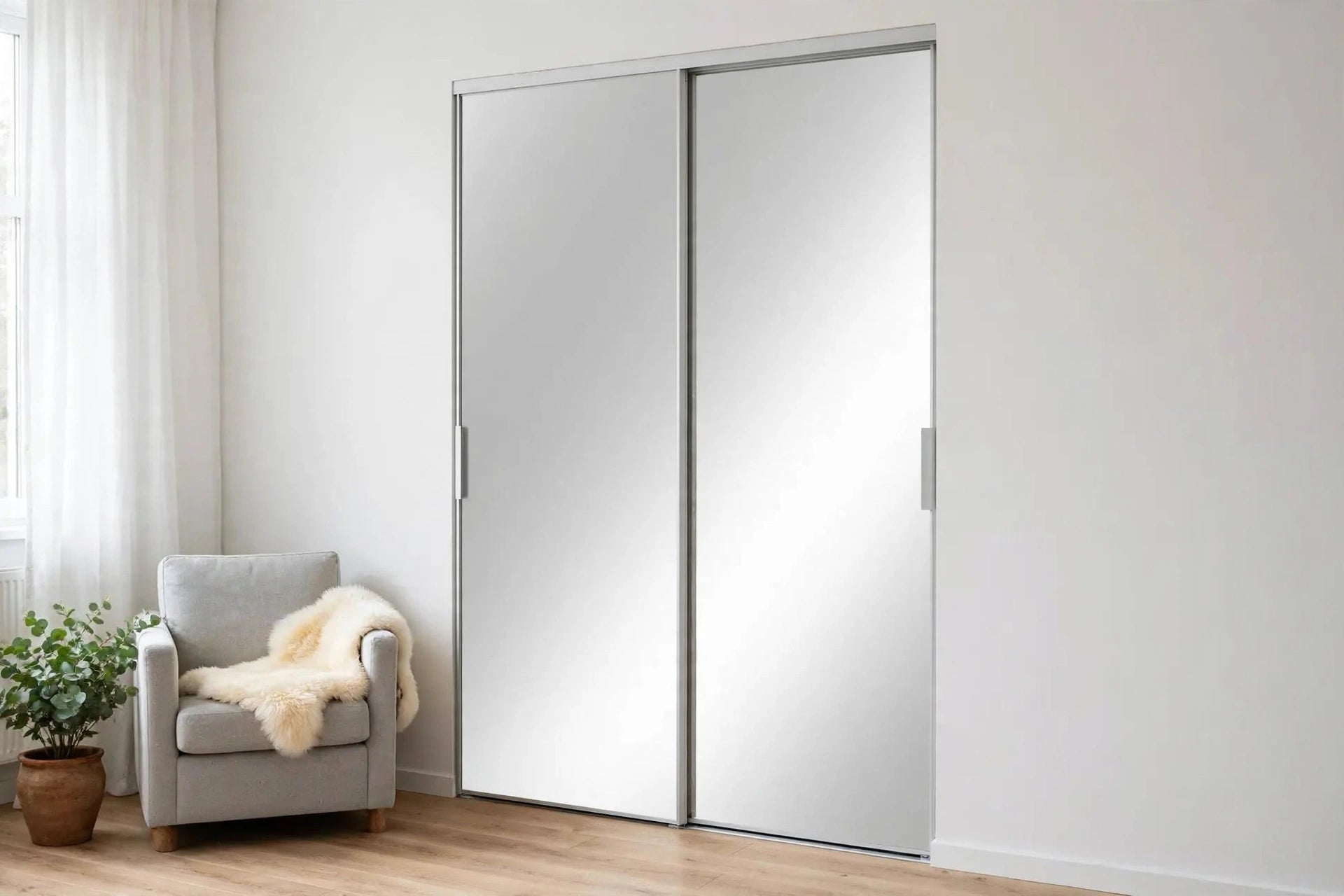 Full mirror sliding closet doors in a bright Nordic bedroom