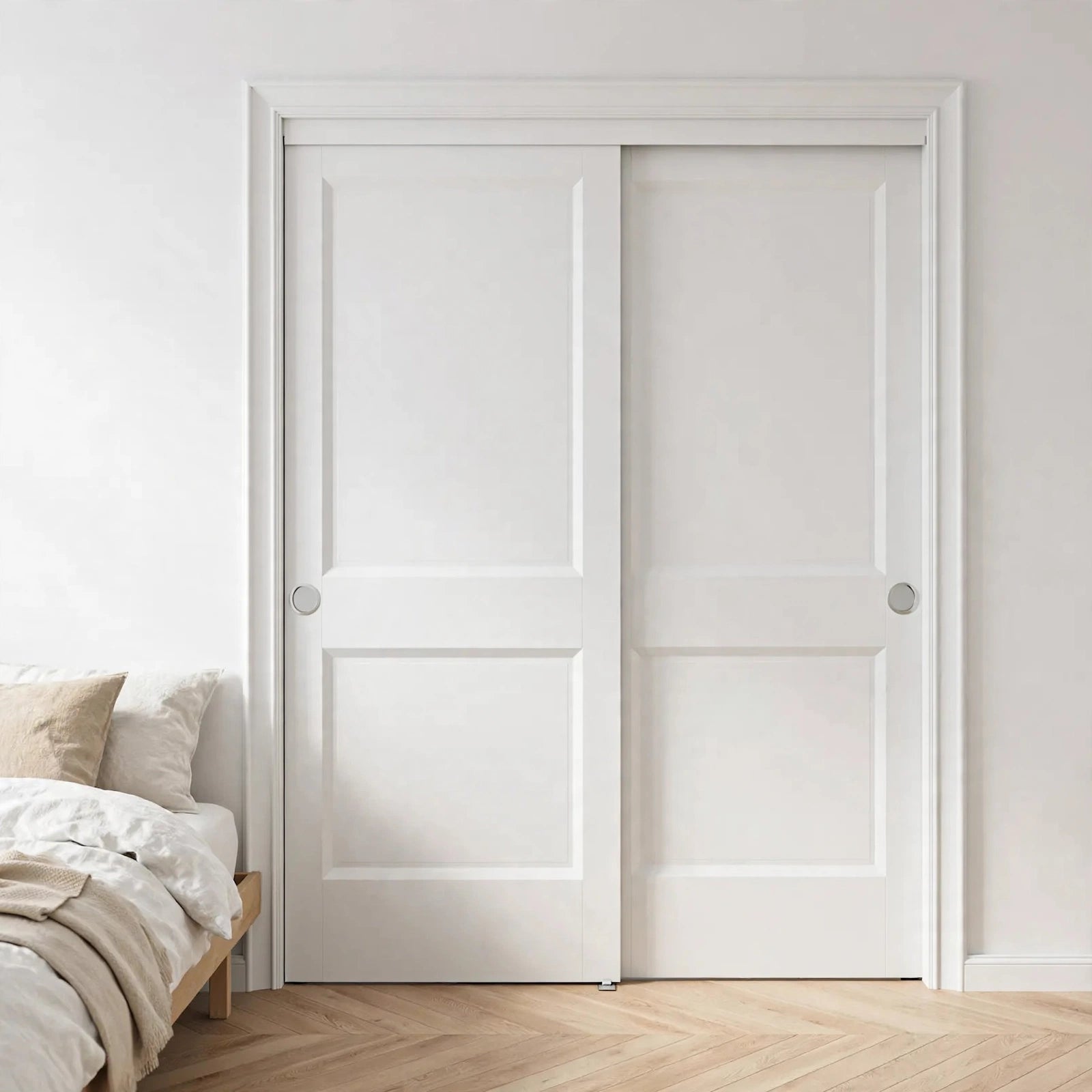 White two-panel sliding closet doors in a Nordic bedroom