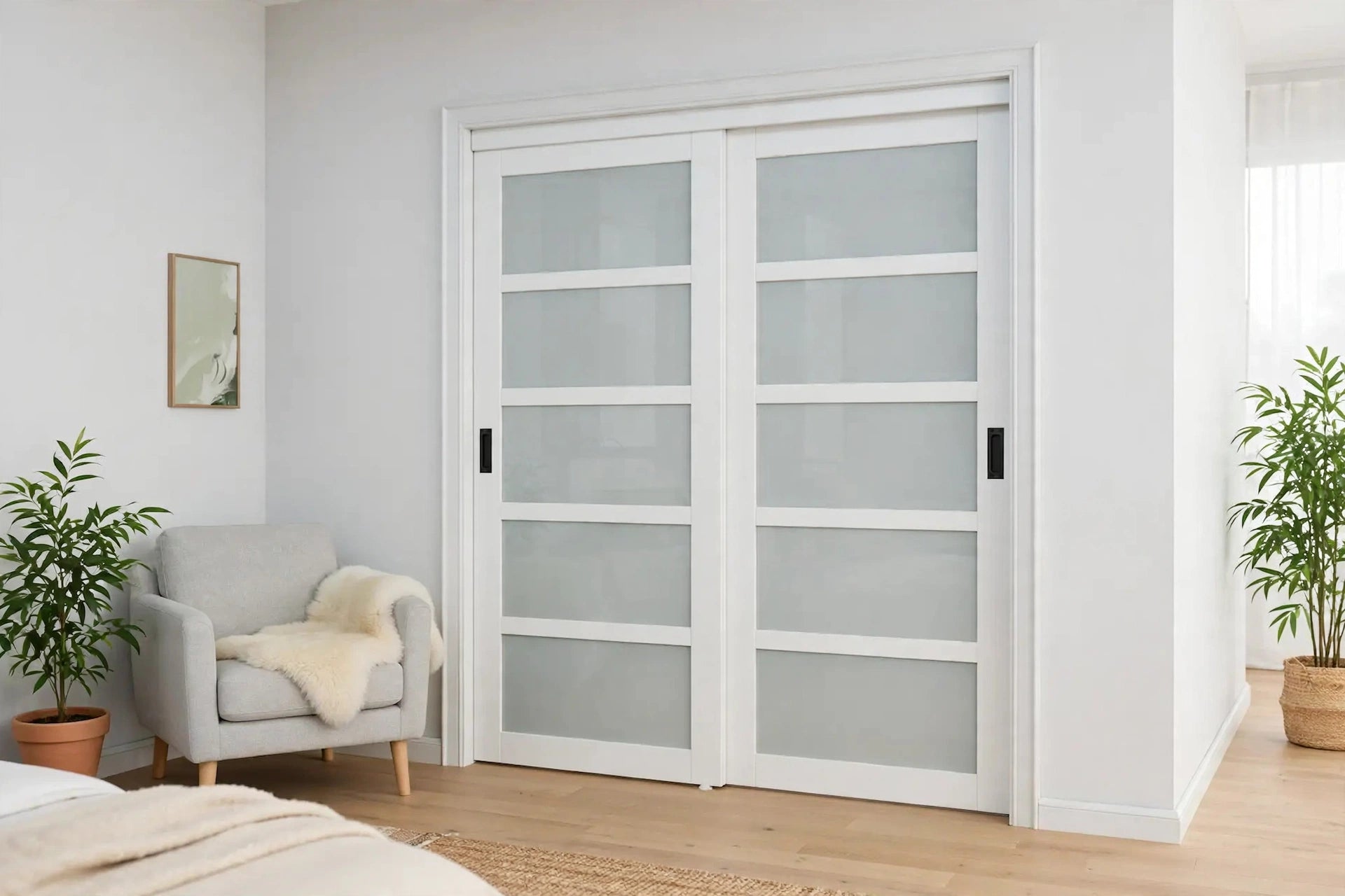 Five-lite frosted glass sliding closet doors with black handles in a Nordic room