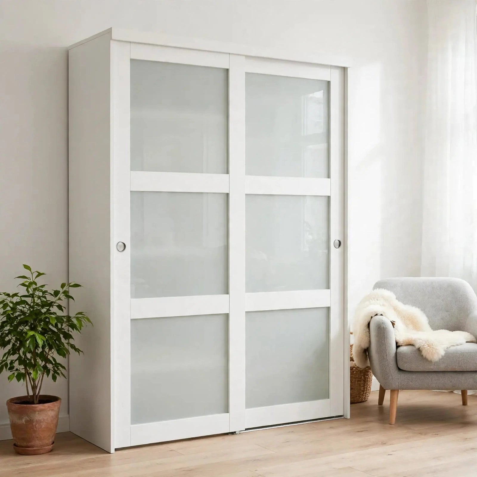 White framed frosted glass sliding closet doors in a Nordic bedroom